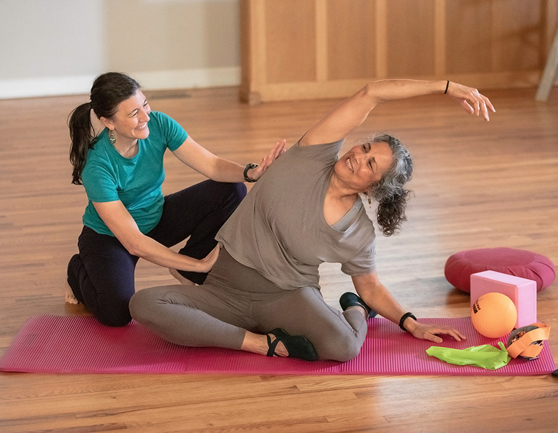 Group Pilates class instruction from Tanya Tracy at Flow PT & Pilates