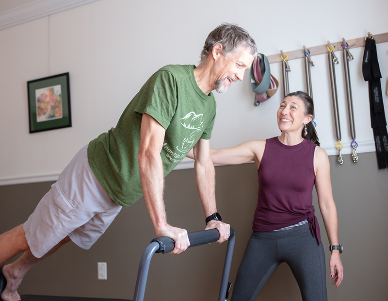 Tanya Tracy instructing individual Pilates session at Flow PT & Pilates in Asheville NC